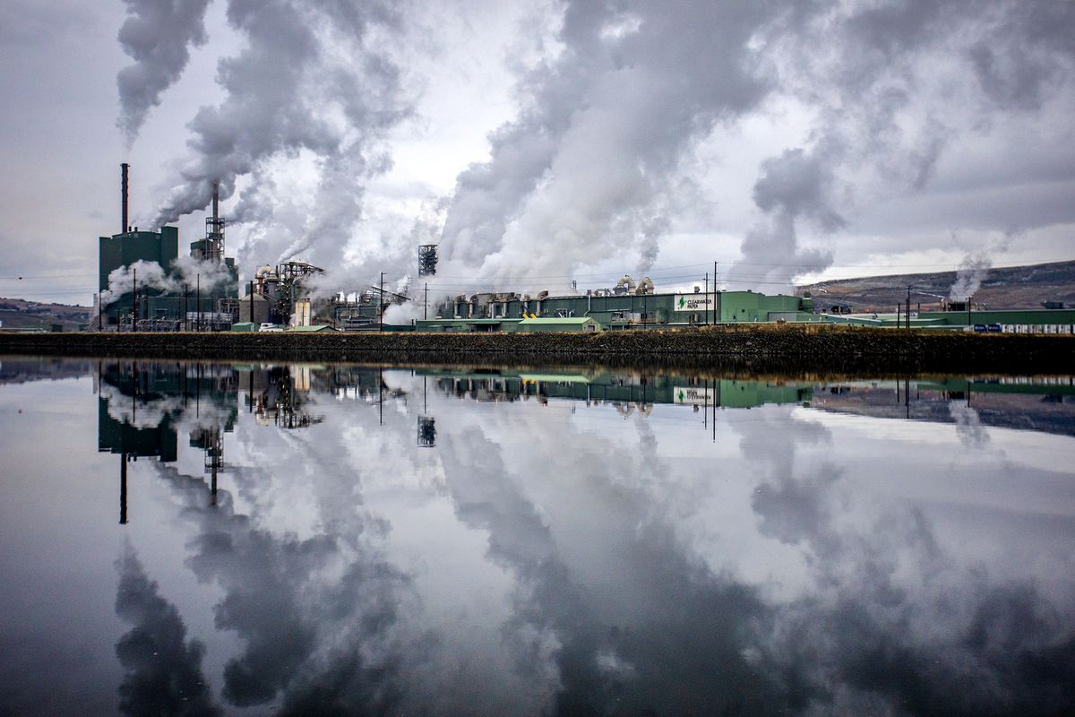 Exhaust from the Clearwater Paper Mill reflects on the surface of the Clearwater River in December.  (August Frank/The Lewiston Tribune)